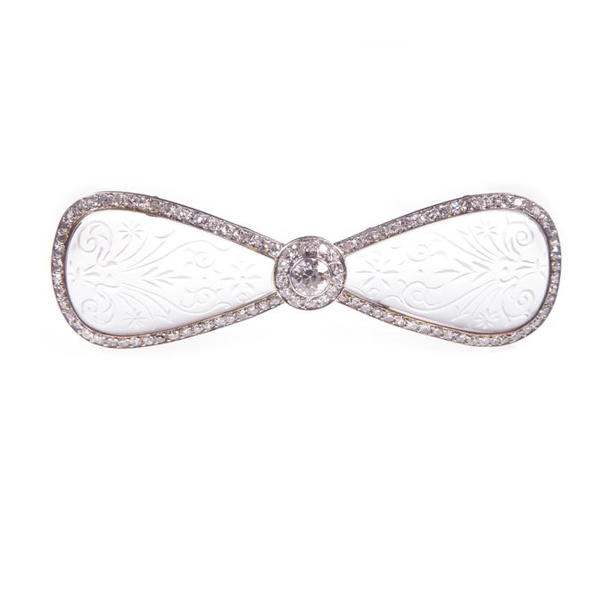   Cartier - Carved rock crystal and diamond bow brooch | MasterArt